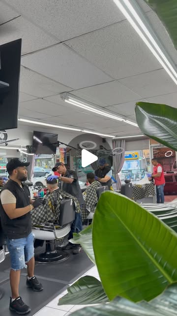 Batista Barbershop barber styling hair